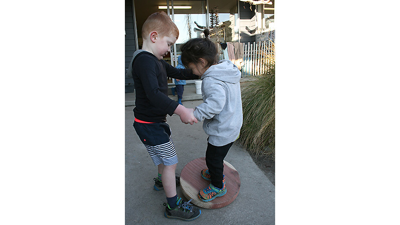 Children on wobbly board at Little Wonders Oamaru daycare