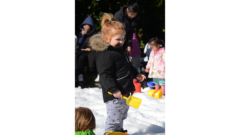 Children enjoying snow at Little Wonder Glendowie daycare snow day