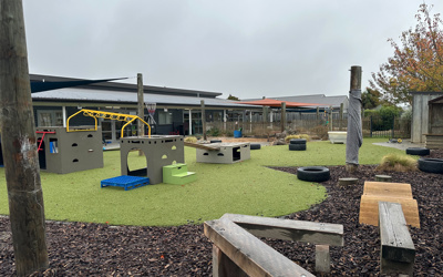 Outdoor play space at Little Wonders Timaru, Tredsafe boxes for climbing, lots of space and challenging fun for children